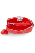 Kipling Creativity Small Purse. A small coral purse with zipper compartment, multiple inner compartments, Kipling logo, and monkey charm.
