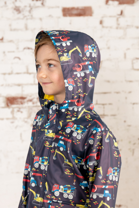 Lighthouse Anchor Jacket. A waterproof, boys jacket with a soft jersey lining, front patch pockets, a zip-up front, and a cool construction print with diggers and trucks.