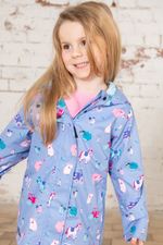 Lighthouse Olivia Jacket. A lightweight, waterproof kids coat with a soft jersey lining, two front pockets, a zip-up front, and a cute farm animal design on a lilac background.