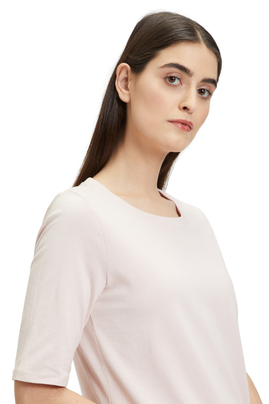 An image of a model wearing the Betty Barclay Plain T-Shirt in the colour Light Rose.