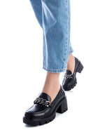 Xti Chunky Heel Loafer. A black vegan leather loafer with chain detail and chunky heeled sole.