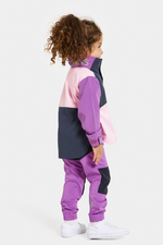 Didriksons Lingon Jacket. A girls windproof jacket in tulip purple with a breathable design, reflective detail, and a water repellent finish