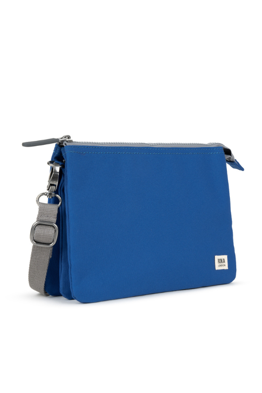 An image of the Roka London Carnaby Crossbody XL Galactic Blue Recycled Canvas Bag.