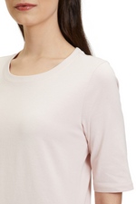 An image of a model wearing the Betty Barclay Plain T-Shirt in the colour Light Rose.