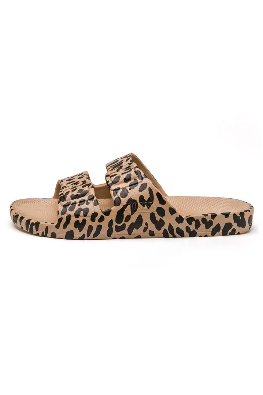 An image of the Freedom Moses Slides in the colour Leo Camel. Beige Sandals with leopard spots all-over.