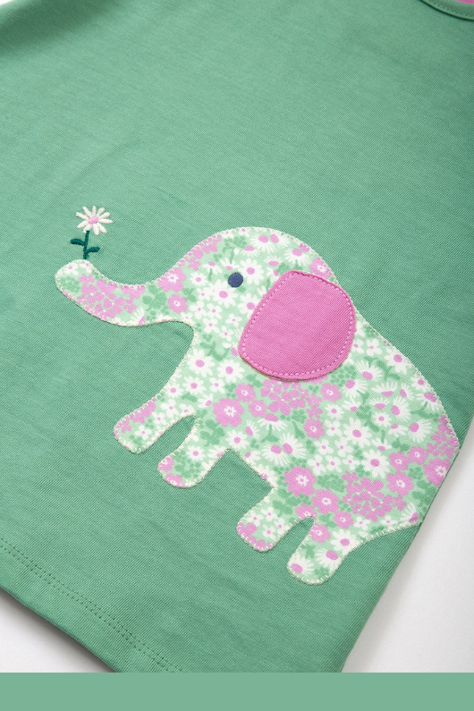 Kite Tunic. A green short sleeve, round neck tunic with elephant applique.