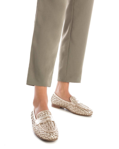Carmela Loafer. A pair of gold moccasin shoes with interlocking design.