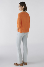 Oui Jumper. An orange, relaxed fit jumper with V-neck, 3/4 length sleeves, and slightly cropped length.