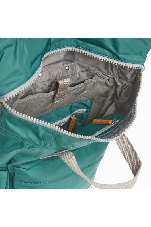 An image of the Roka London Canfield B Rucksack in the colour Teal.