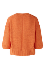 Oui Jumper. An orange, relaxed fit jumper with V-neck, 3/4 length sleeves, and slightly cropped length.