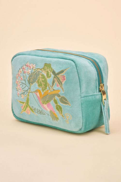 Powder Hummingbird Make Up Bag. A spacious makeup bag with zip closure, a bright blue design, and a hummingbird & floral print