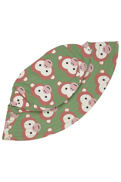 Pigeon Organics Reversible Sunhat. A sun hat with green monkey print on one side and stripe print on the reverse.