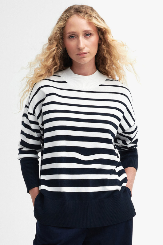 An image of a female model wearing the Barbour Marloes Knited Jumper in the colour Ecru Stripe.