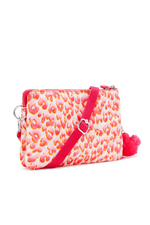 Kipling Riri Small Crossbody Bag in Latin Cheetah. A small zip bag with a pink cheetah print and a fluffy monkey keychain.