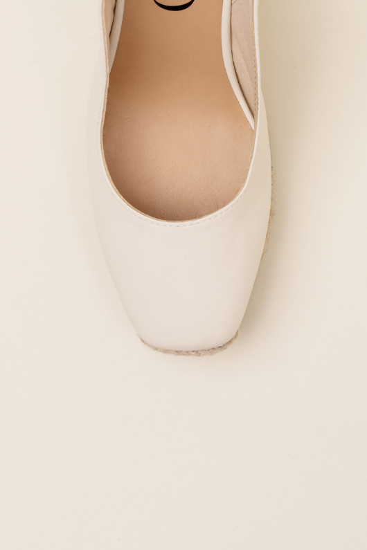 An image of the Gaimo Teyma Marble Wedge Slingbacks in Cream.