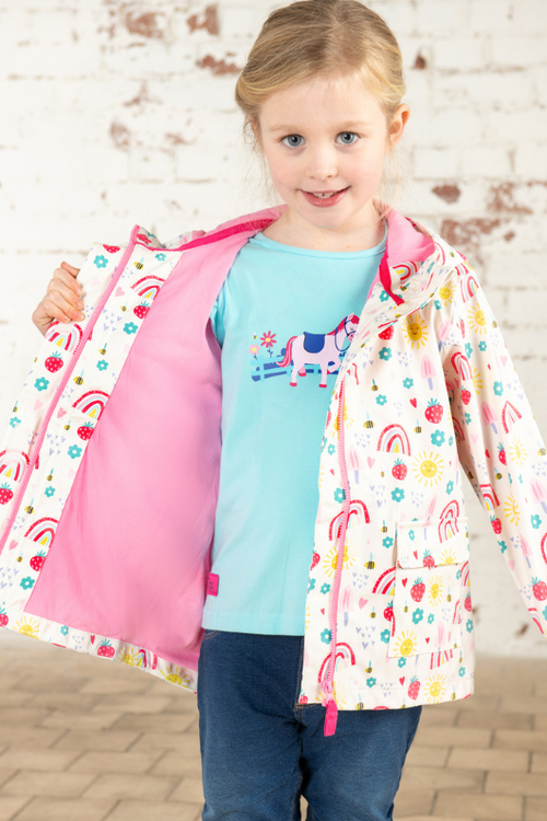 Lighthouse Heidi Jacket. A kids, waterproof coat with a soft jersey lining, and a sweet rainbows & sunshine design on a white background.