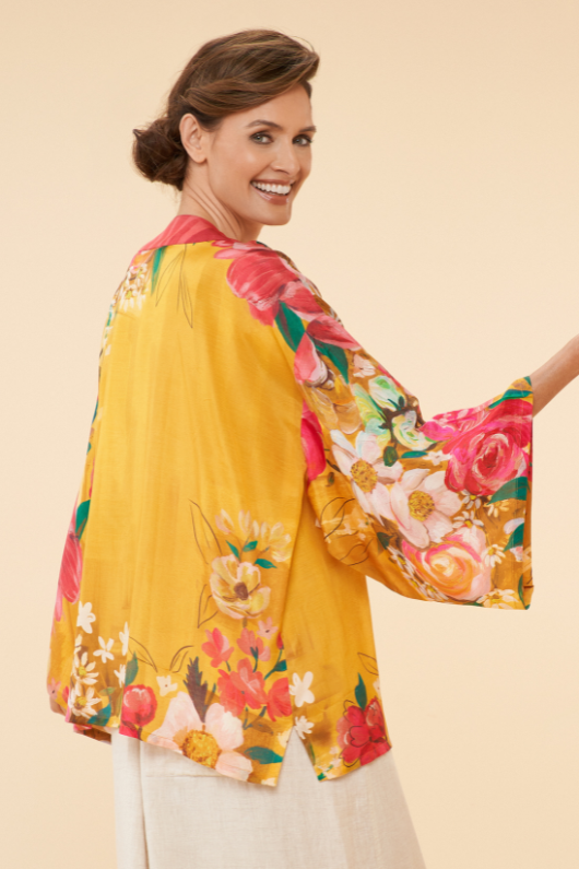 Powder Kimono Jacket. A hip-length, open style jacket with a bright mustard floral print