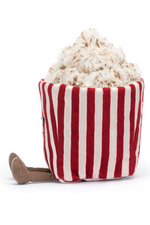 Jellycat Amuseable Popcorn. A soft toy with cuddly red and white striped carton and fluffy popcorn top, complete with smiling face and little legs