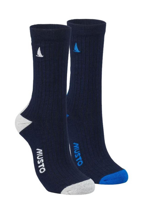 An image of the Musto Marina 2 Pack Socks. Knitted, full stretch socks on a navy background - one with a grey heel, toe & boat embroidery, the other with blue heel, toe & boat embroidery.