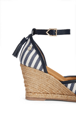 Fairfax & Favor Monaco Wedge Sandal. A pair of Navy striped sandals with tonal embroidered toe, tassel detail, wedge heel, and espadrille style sole.