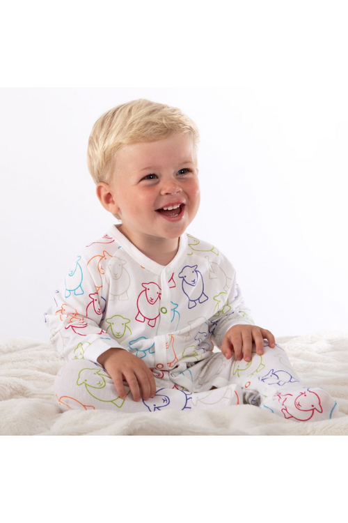 An image of the Herdy Company's Baby Marra Sleepsuit with colourful sheep outlines all-over.