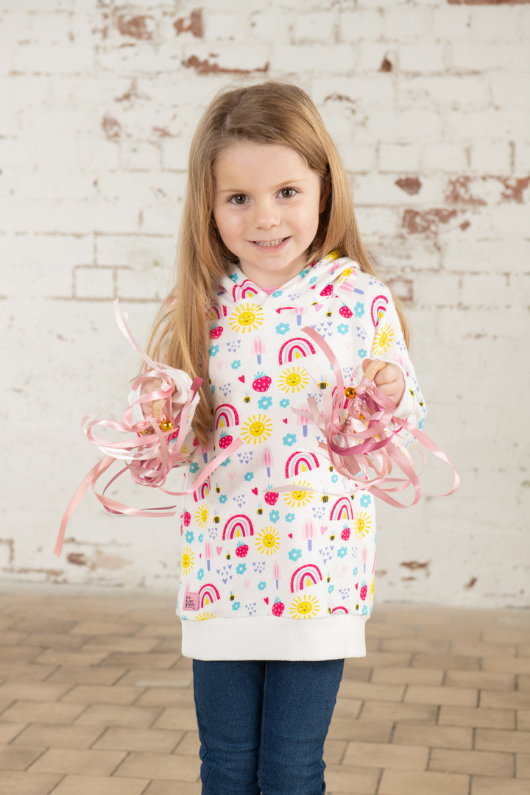 Lighthouse Jessie Hoodie. A regular fit, kids hoodie with a cosy jersey lined hood and a sweet rainbows and sunshine design on a white background.