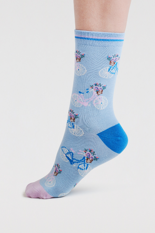 An image of the Thought Rosette Bike Socks in the colour Klein Blue.