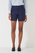 An image of a female model wearing the Crew Clothing Chino Shorts in the colour Navy.