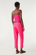 An image of a female model wearing the BA&SH Club Trousers in the colour Pink.