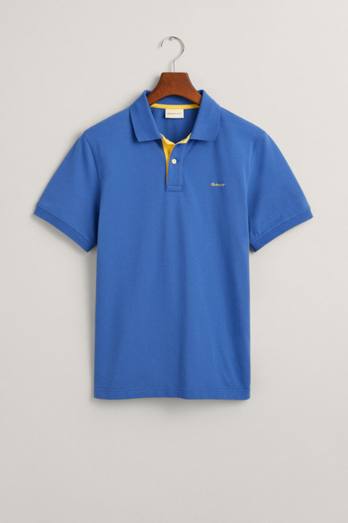 Gant Contrast Pique Polo Shirt. A regular fit men's polo shirt with a flat knit collar, contrast colour detail and a rich blue finish