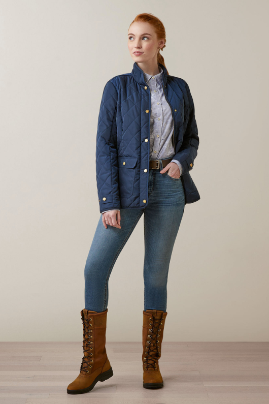 An image of a female model wearing the Ariat Woodside Jacket in the colour Navy.