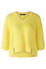 Oui 3/4 Sleeve Jumper. A yellow boxy fit jumper with 3/4 length sleeves, V-neckline, and split hem.