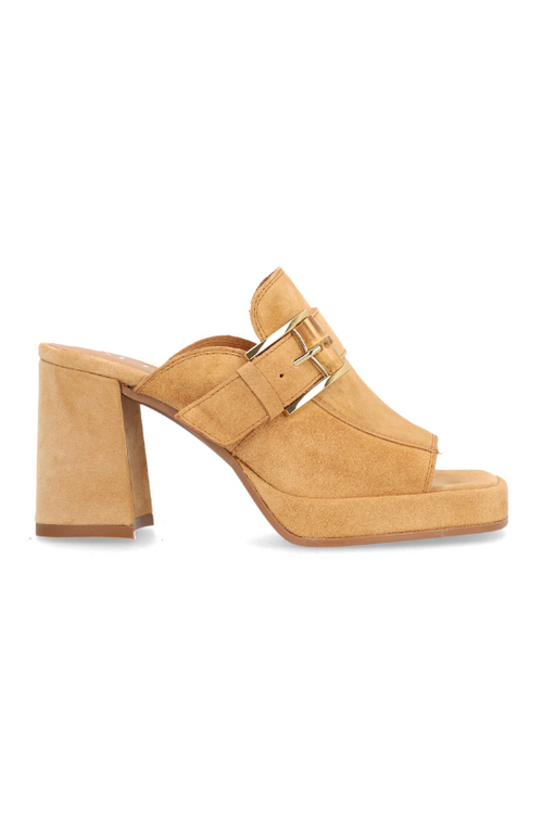 Alpe Platform Slip On Sandal. A tan, block heel sandal with a backless design, open toe, and gold buckle detailing on a suede upper.