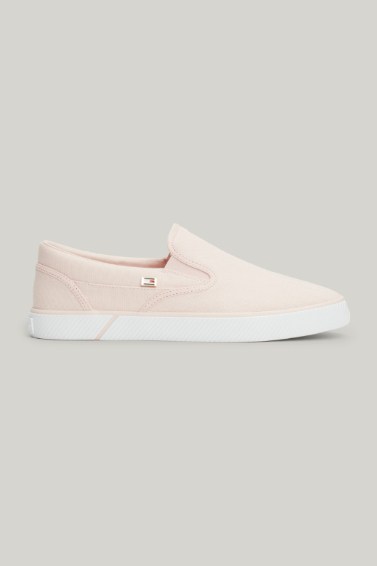 An image of the Tommy Hilfiger Enamel Flag Slip-On Canvas Trainers