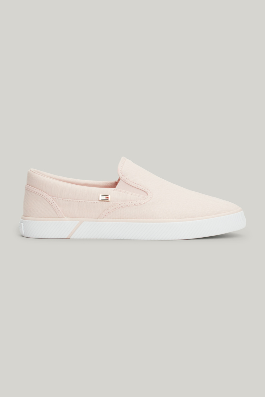 An image of the Tommy Hilfiger Enamel Flag Slip-On Canvas Trainers in the colour Whimsy Pink.