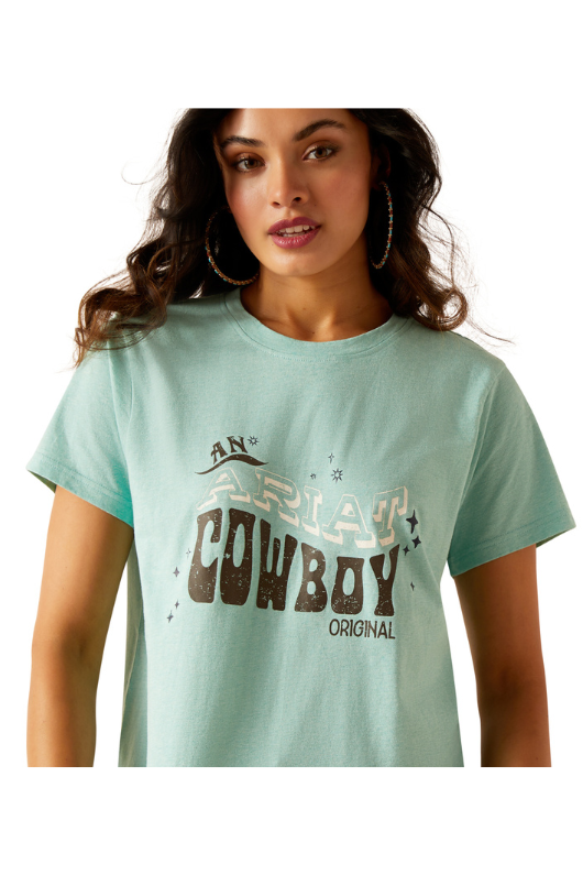 An image of a female model wearing the Ariat Cowboy T-Shirt in the colour Aqua Heather.