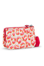 Kipling Creativity S Purse. A small zip purse with multiple interior pockets, a round Kipling logo on the front, a fluffy Kipling monkey keychain and a pink cheetah print design