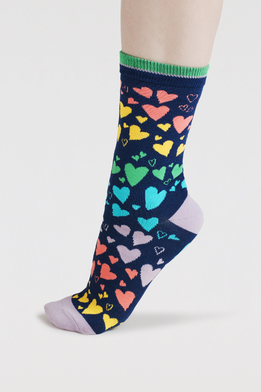 An image of the Thought Socks Eva Heart Scatter Bamboo Socks in the colour Indigo Blue.