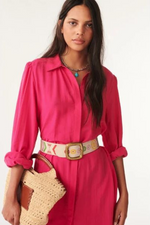 An image of a female model wearing the BA&SH Lara Shirt Dress in the colour Fuchsia.