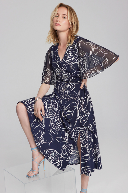 An image of a female model wearing the Joseph Ribkoff Crossover Dress in the colour Midnight Blue/Vanilla.
