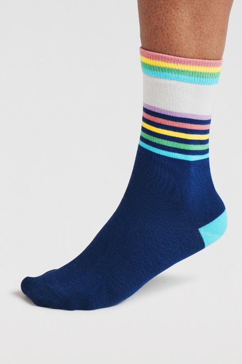 An image of the Though Clara Rainbow Stripe Socks in the colour Indigo Blue.