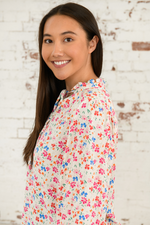 Lighthouse Lola Blouse. A relaxed fit, long sleeve blouse with a tie neck, 3/4 length sleeves and a sweet floral print