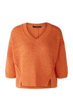 Oui Jumper. An orange, relaxed fit jumper with V-neck, 3/4 length sleeves, and slightly cropped length.