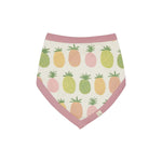 Pigeon Organics Bib. A reversible bib with stripes on one side and pink and multicoloured pineapples on the reverse.