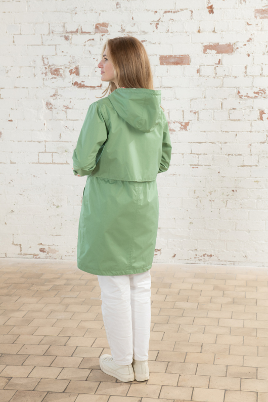 Lighthouse Pippa Coat. A waterproof women's jacket in soft green with an adjustable drawstring waist, a two-way front zip, a cosy cotton blend lining, and handy pockets.