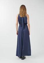 Dea Kudibal Nataliah Maxi Dress. A sleeveless dress with halter neck and full-length skirt, in the colour navy.