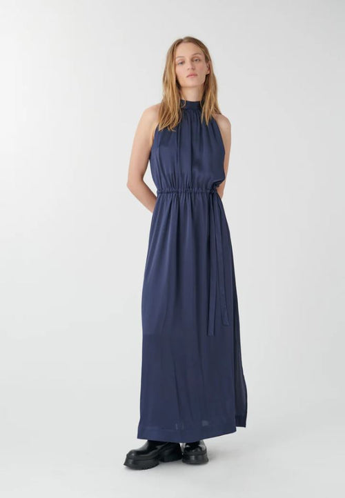 Dea Kudibal Nataliah Maxi Dress. A sleeveless dress with halter neck and full-length skirt, in the colour navy.