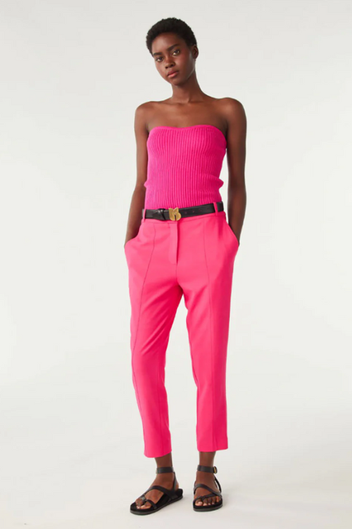 An image of a female model wearing the BA&SH Club Trousers in the colour Pink.