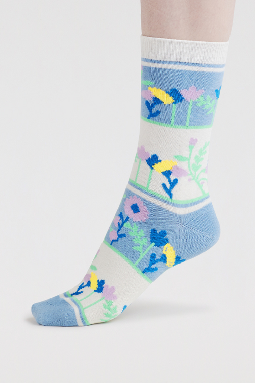 An image of the Thought Freya Floral Gardnen Socks in the colour Violet Blue.