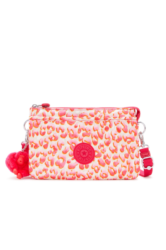 Kipling Riri Small Crossbody Bag in Latin Cheetah. A small zip bag with a pink cheetah print and a fluffy monkey keychain.